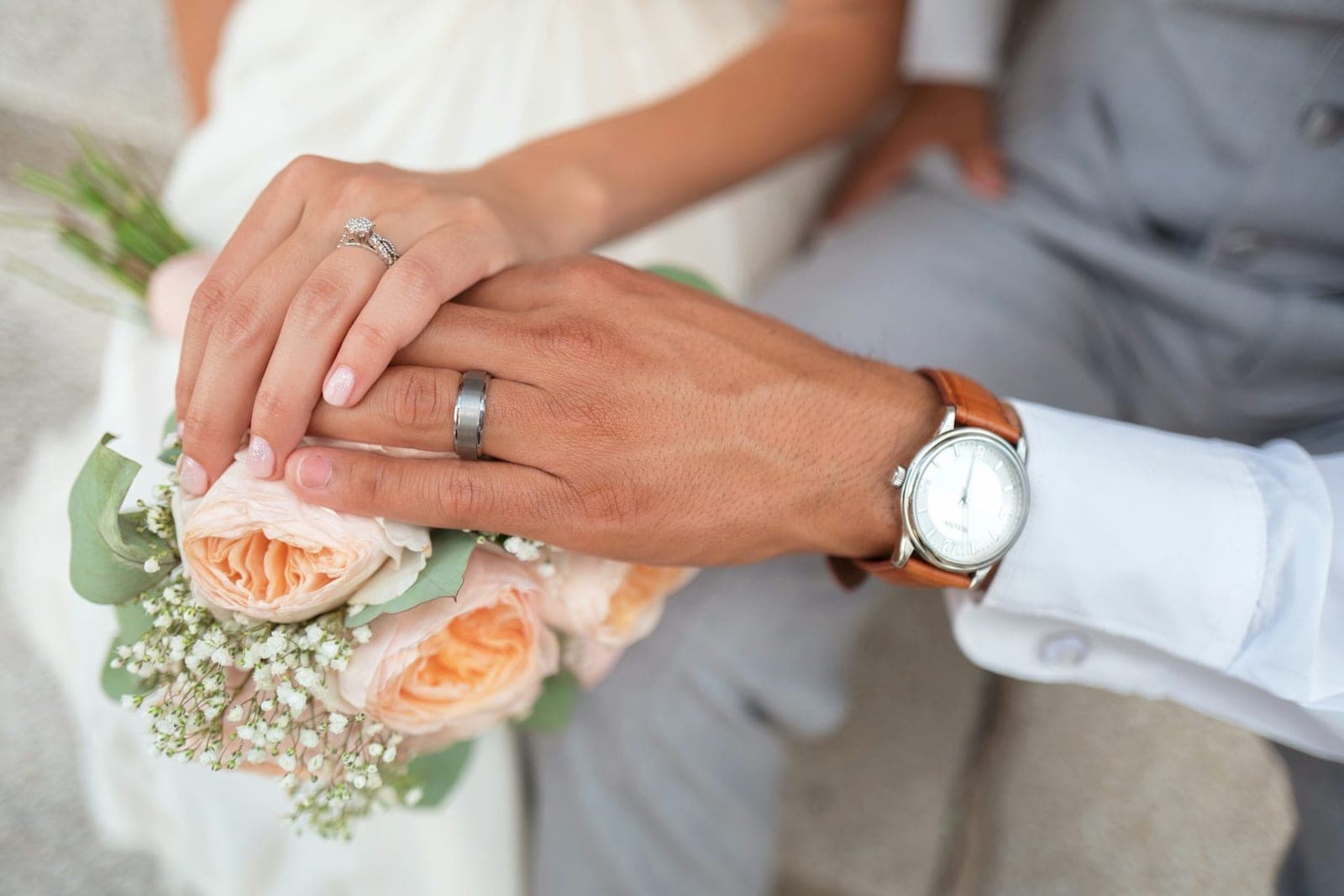 Hands together, rings on