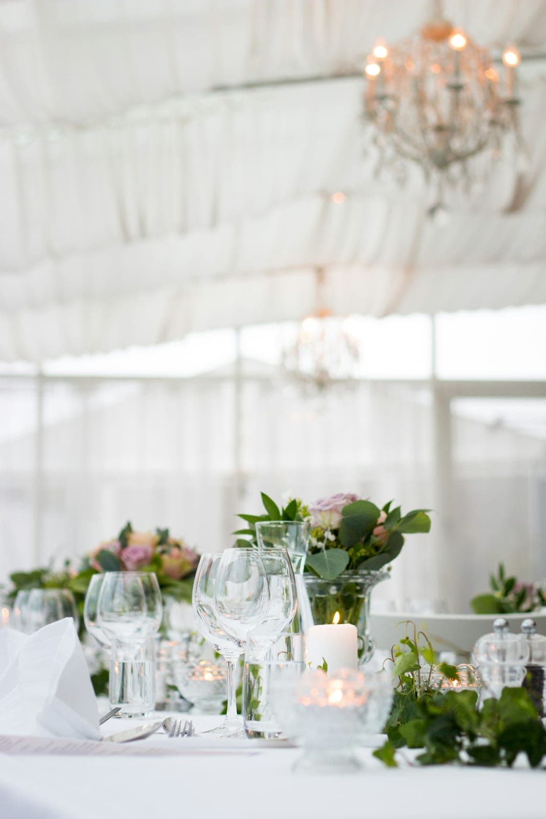 A long table laid for dinner in a marquee
